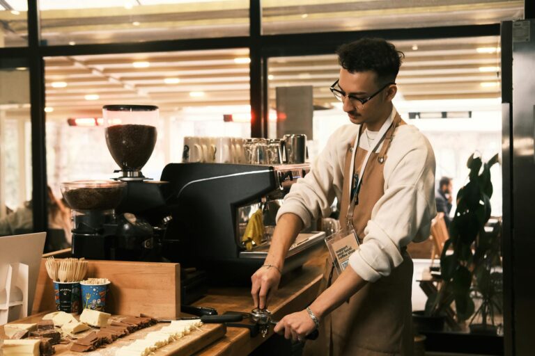 Barista preparing espresso in modern Konya café, showcasing coffee craft and equipment.